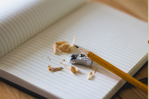 Boy writing letters in classroom